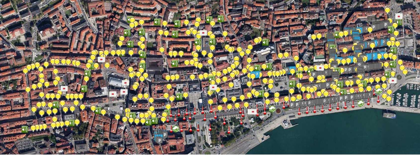 Environmental monitoring and management in Santander city centre. Almost 400 parking sensors have been placed under the asphalt of the main parking areas of the city centre to detect parking site availability. On top of this, 2000 IoT devices have been installed at streetlights and facades providing measurements on different environmental parameters such as temperature, CO, noise, light and car presence. Copyright and source: The SmartSantander project